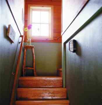 
Stairs from the lower power room, made from recycled Douglas fir, invite a healthy climb up through the Solar Lookout.
